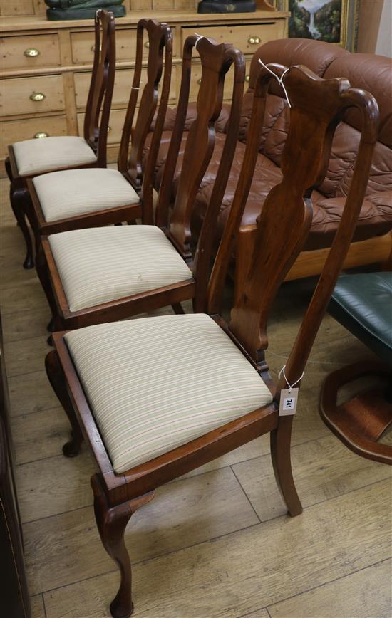 A set of four Edwardian walnut dining chairs